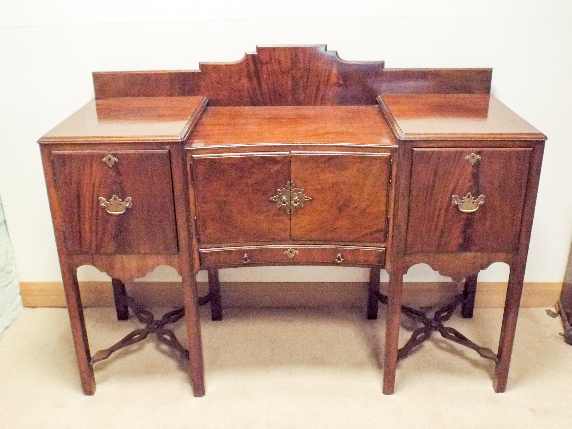 A Waring and Gillow shaped front mahogany sunk top sideboard fitted two drawers and centre