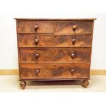 Victorian mahogany chest of three long and two short drawers with bun handles standing on turned