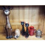 Four various carved wood and other cat ornaments,