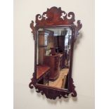 A Georgian mahogany wall mirror with carved mahogany frame approx 33" x 18"