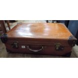 A brown leather suitcase