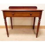 A Victorian mahogany writing or hall table fitted one long drawer standing on turned legs