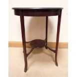 An Edwardian two tier circular inlaid mahogany occasional table