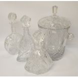 Three various crystal glass decanters with stoppers and a glass ice pail