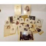 A box of old Victorian photographs of people