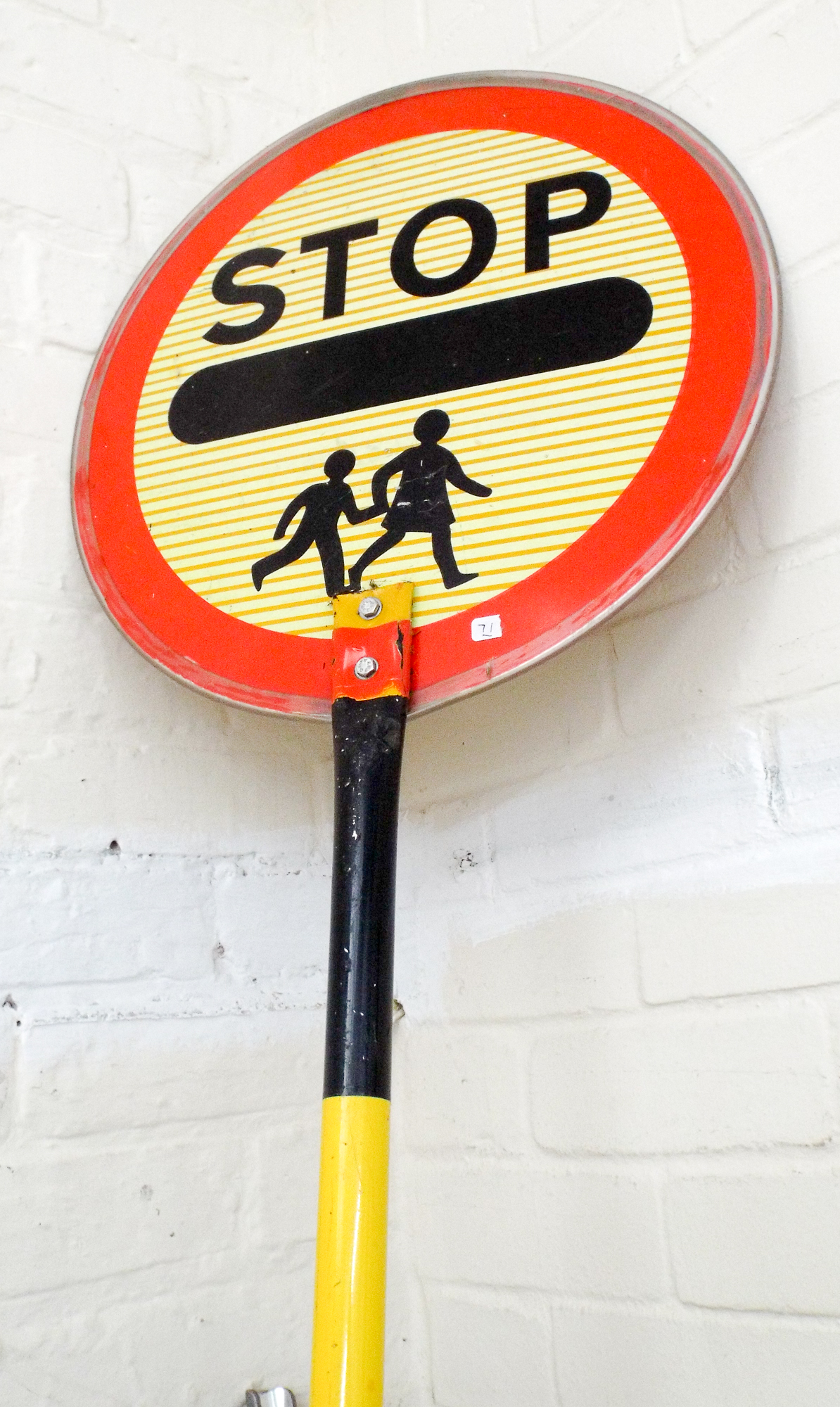 A Lollipop Lady 'Stop children crossing'