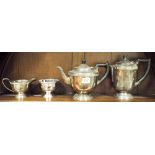 A four piece late Victorian plated tea set