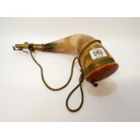 A powder flask made from a cows horn overall length is 32cms