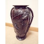 A large Japanese bronze two handled vase or umbrella stand,