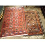 Two red patterned Bokhara rugs one is 60"x36" the other 49"x33"