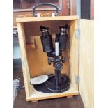 A Binocular microscope in wooden box