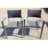 Four metal framed stacking garden elbow chairs