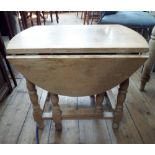 A light oak gate leg style coffee table approx 2' wide