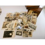 A small stained pine box containing many hundreds of family photos from the late 1890s through to
