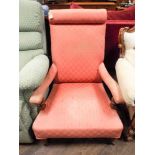 A late Victorian mahogany framed elbow chair in pink covering