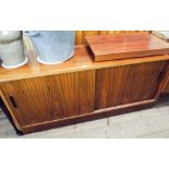 A 1970's Danish sideboard with a blonde wood interior and plywood back.