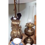 A brass table lamp with white shade