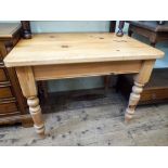 A pine farmhouse style kitchen table on turned legs approx 3'3 x 2'3