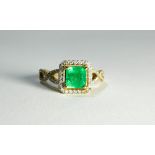 An 18ct yellow gold emerald and diamond cluster ring set with a princess cut emerald surrounded by