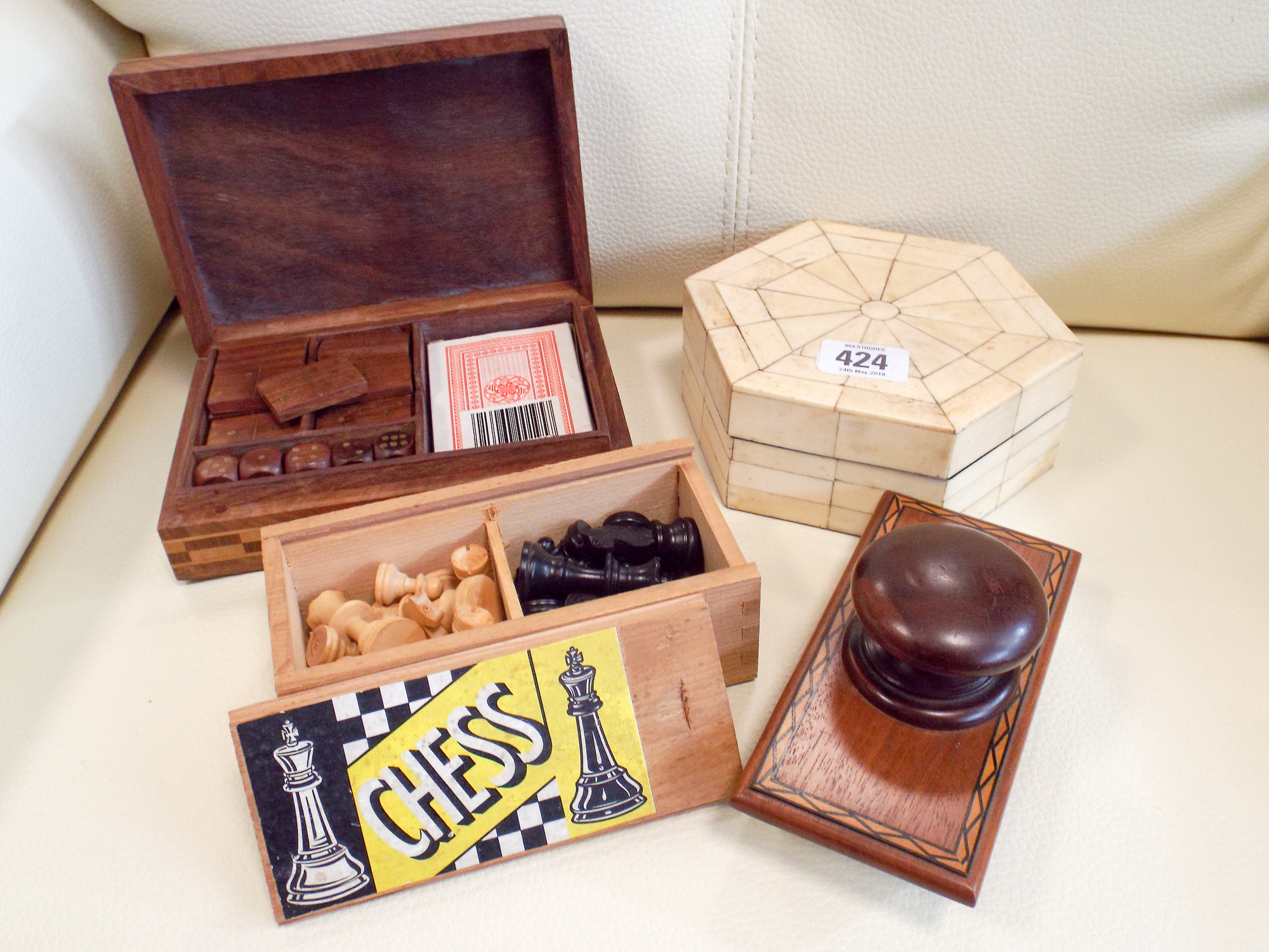 A small chess set, dominoes, card games, blotter, trinket box,