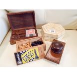 A small chess set, dominoes, card games, blotter, trinket box,