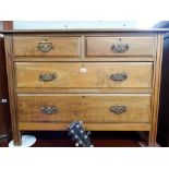 A stripped Edwardian walnut chest of two long and two short drawers,
