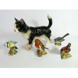 A Beswick black and white cat and four British birds
