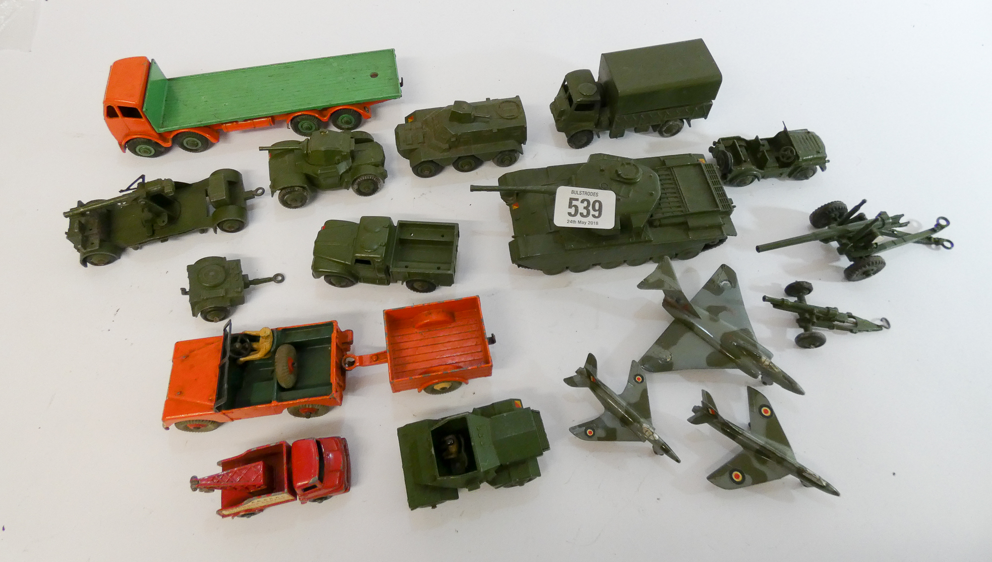 A small collection of Dinky cars and toys, mostly military items such as tanks, guns,