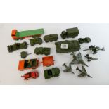 A small collection of Dinky cars and toys, mostly military items such as tanks, guns,