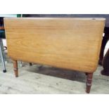 A Victorian mahogany drop leaf dining table on turned legs 3' wide