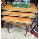 A nest of 3 French style coffee table with gilt metal mounts