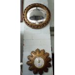 A small gilt sunburst wall clock and a small gilt convex mirror