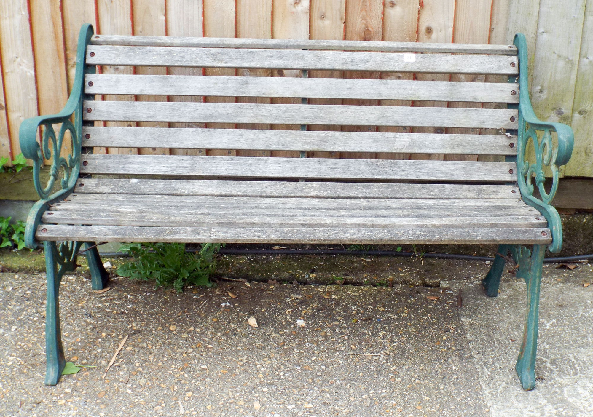 A metal ended wood based garden bench