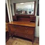 An Edwardian inlaid mahogany dressing chest,