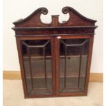 An Edwardian inlaid mahogany, two door, glazed, wall hanging bookcase,