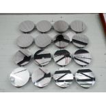 Sixteen circular wall mirrors on frame