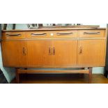 A long low GPlan teak sideboard fitted cupboards and three drawers 5' wide