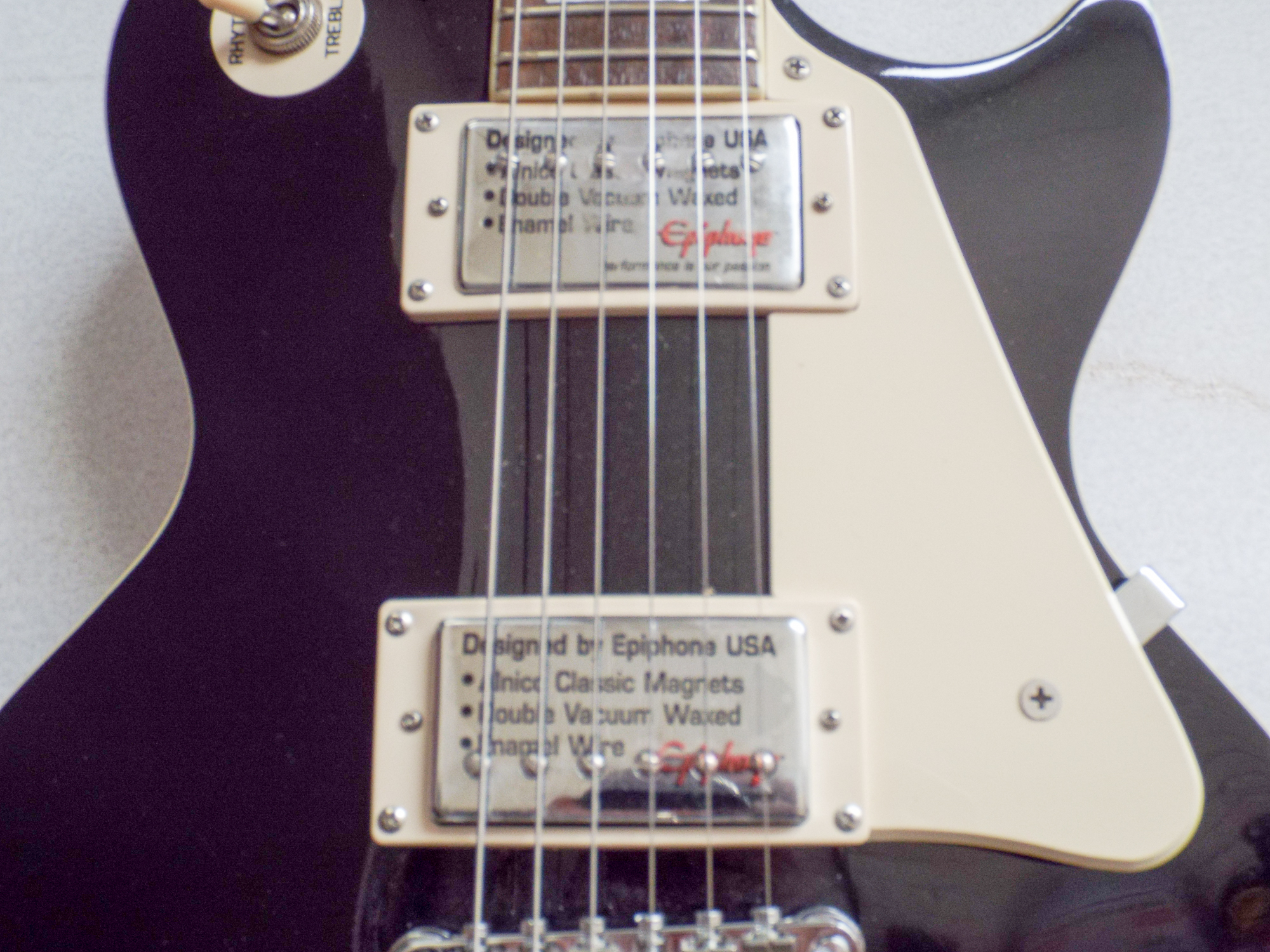 An Epiphone Les Paul model black and cream electric guitar with a mother of pearl inlaid neck with - Image 2 of 3