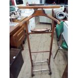 A wooden valet stand