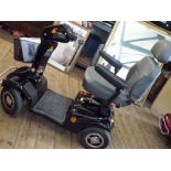 A Rascal 388XL four wheel mobility scooter in good condition in a black case