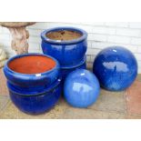 Four large blue ceramic garden pots and two large blue globe shaped garden ornaments