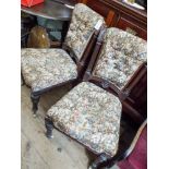 A pair of late Victorian mahogany framed dining chairs upholstered in figured tapestry