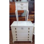 A white and gilt kidney shaped dressing table,