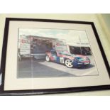 Photograph of the raising of Bluebird 2001 and two framed photographs of racing cars