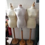 Three female top half mannequins on wooden bases