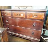 A mahogany finished chest of three long drawers,