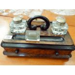 A Victorian walnut inkstand,