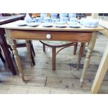 A Victorian stripped pine bow front side table, fitted drawer on turn legs.