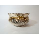 Eastern silver 900 standard bowl, with embossed floral decoration and silver gilt wire trim. 5.