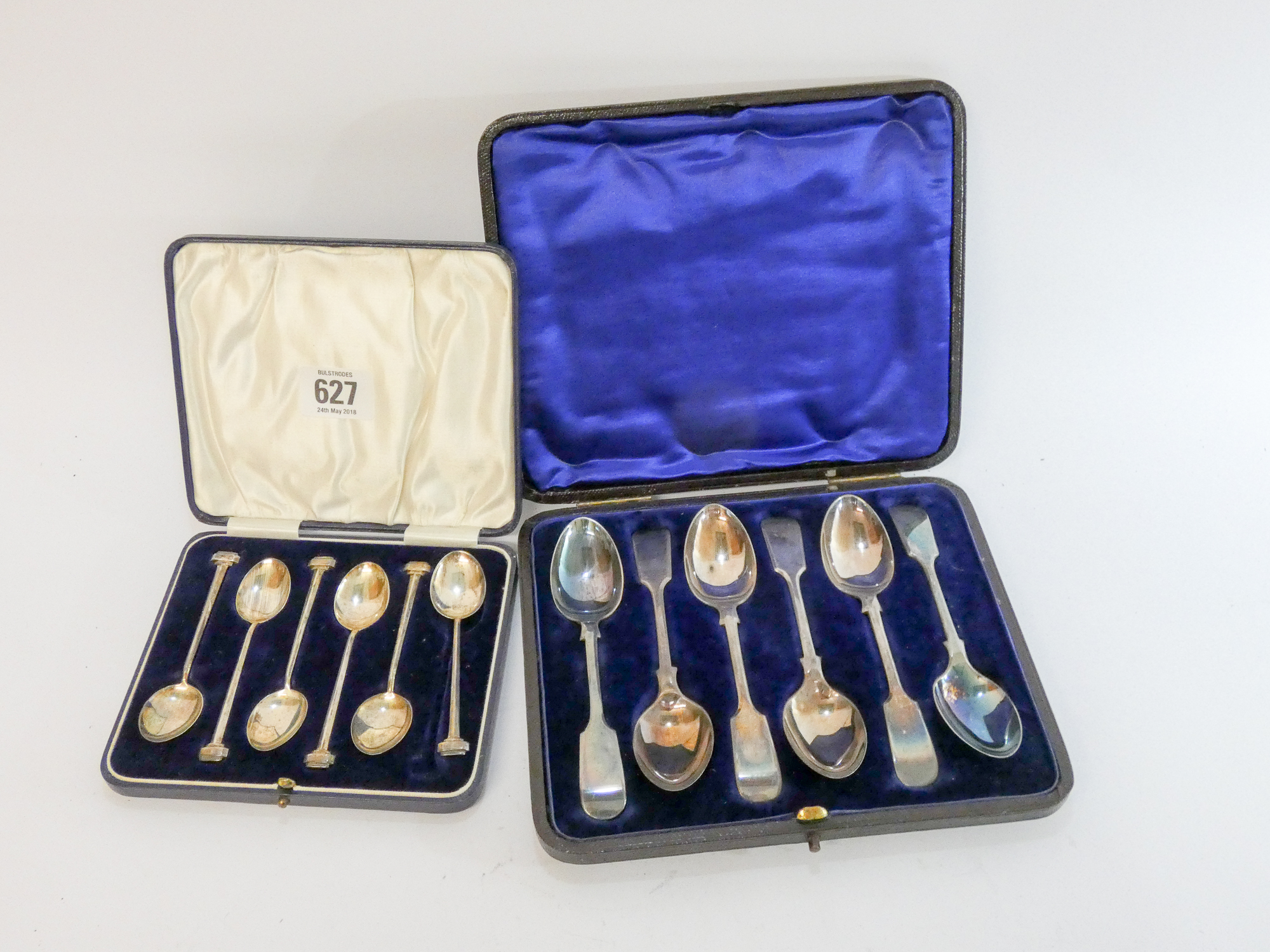 A set of six silver fiddle pattern tea spoons in case and a set of six bean ended coffee spoons